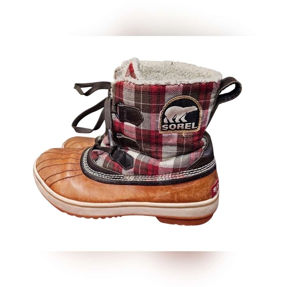 Sorel boots with plaid winter boots. Size 9